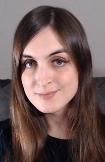 A photo of Amelie C. Langlois, the author. She has long brown hair, and green eyes.