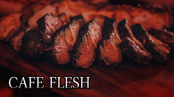 A table of cooked meat, cut into slices.