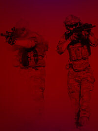 Two men in tactical gear emerging from a haze of snow, rifles in hand.